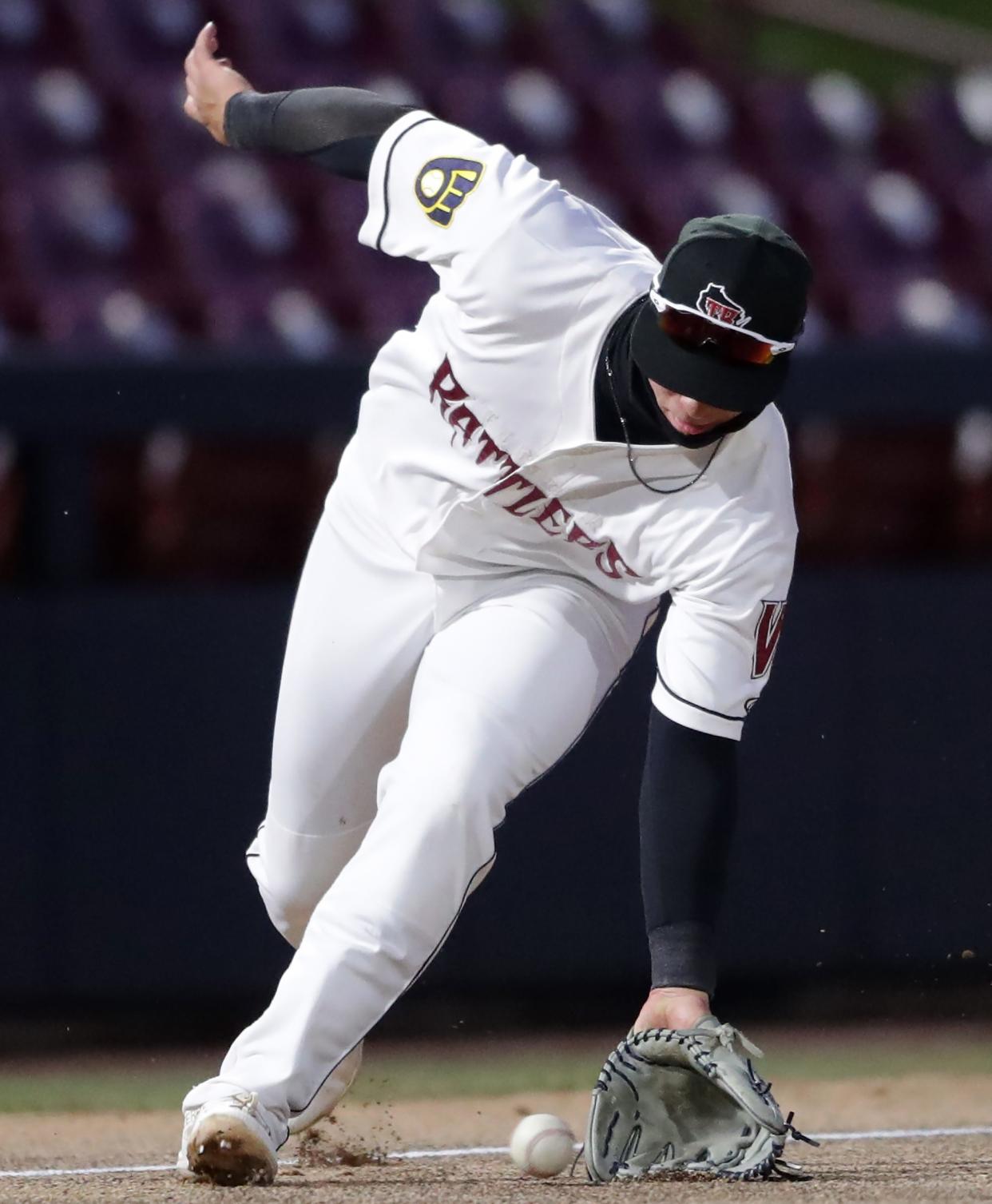 The Timber Rattlers' Mike Boeve fields a ball during the home opener April 5 at Fox Cities Stadium in Grand Chute.