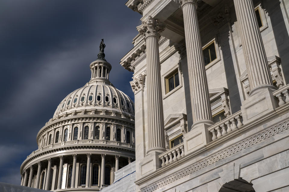 FILE - The Capitol Dome and the West Front of the House of Representatives are seen in Washington, Monday, April 17, 2023. On Friday, Dec. 15, The Associated Press reported on stories circulating online incorrectly claiming the federal government gives people who enter the U.S. illegally a cell phone, a domestic plane ticket to a location of their choosing and a $5,000 Visa gift card. (AP Photo/J. Scott Applewhite, File)