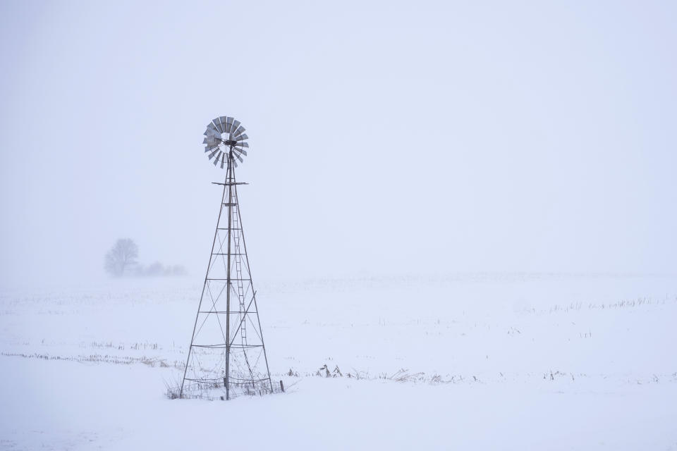 FILE - A windmill is seen near Merrill, Iowa, on Jan. 12, 2024. The Arctic-like temperatures that are raising concerns about turnout for the Iowa caucus on Monday, Jan.15, are putting the spotlight on a presidential nominating system that has long been criticized as archaic and undemocratic. (AP Photo/Carolyn Kaster, File)