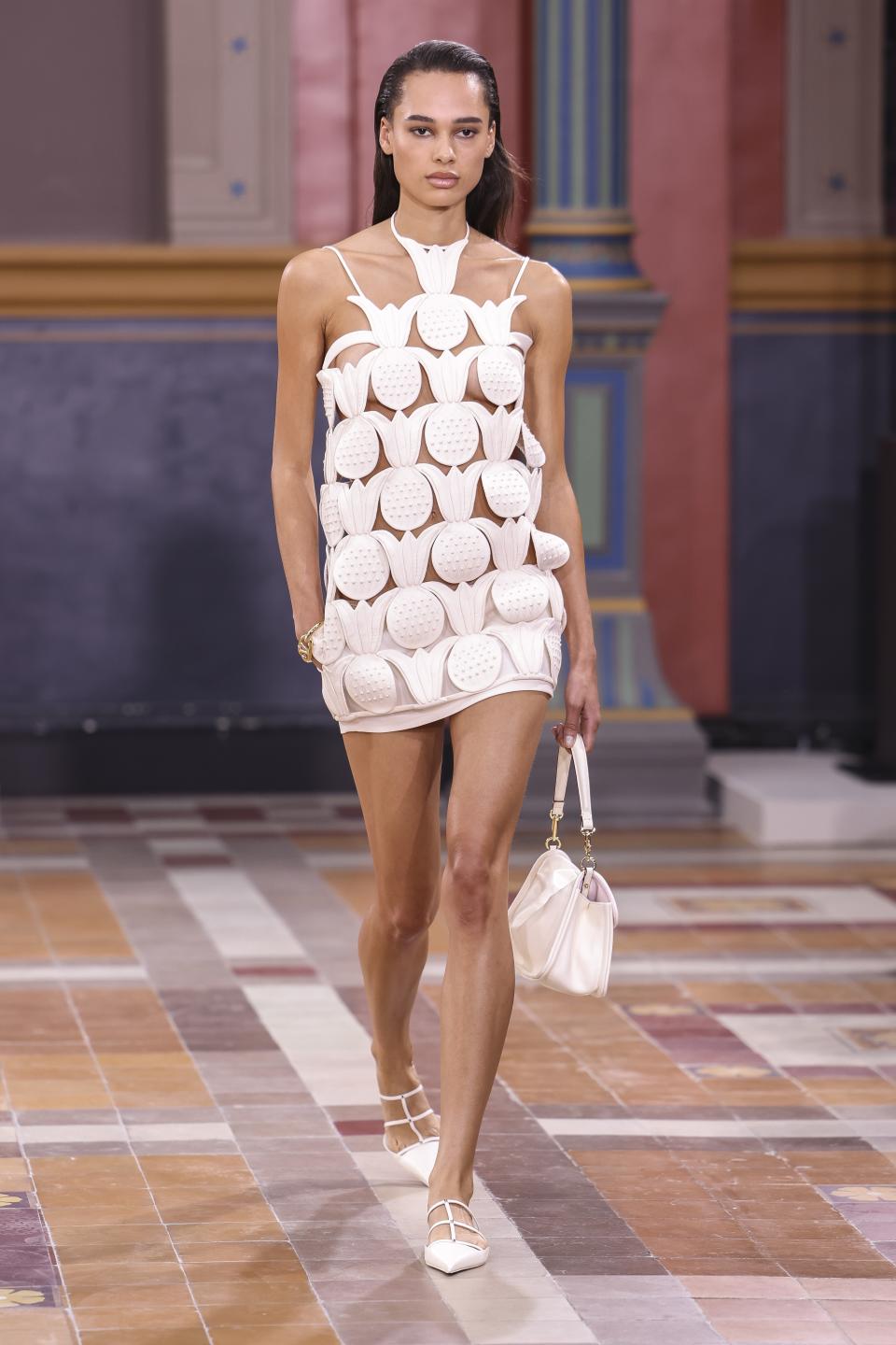 A model wears a creation for the Valentino Spring/Summer 2024 womenswear fashion collection presented Sunday, Oct. 1, 2023 in Paris. (AP Photo/Vianney Le Caer)