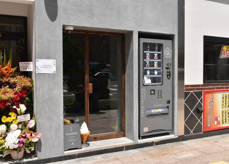 The vending machine has been cleverly integrated into the surrounding building.