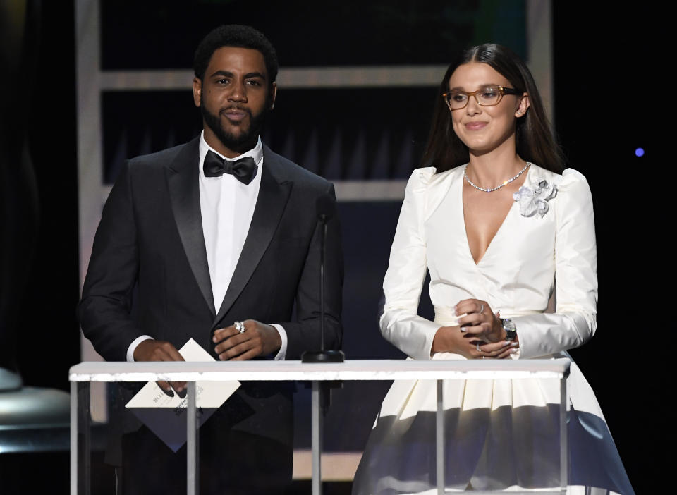 Jharrel Jerome and Millie Bobby Brown speak onstage during the 26th Annual Screen Actors Guild Awards at The Shrine Auditorium on January 19, 2020 in Los Angeles, California. 