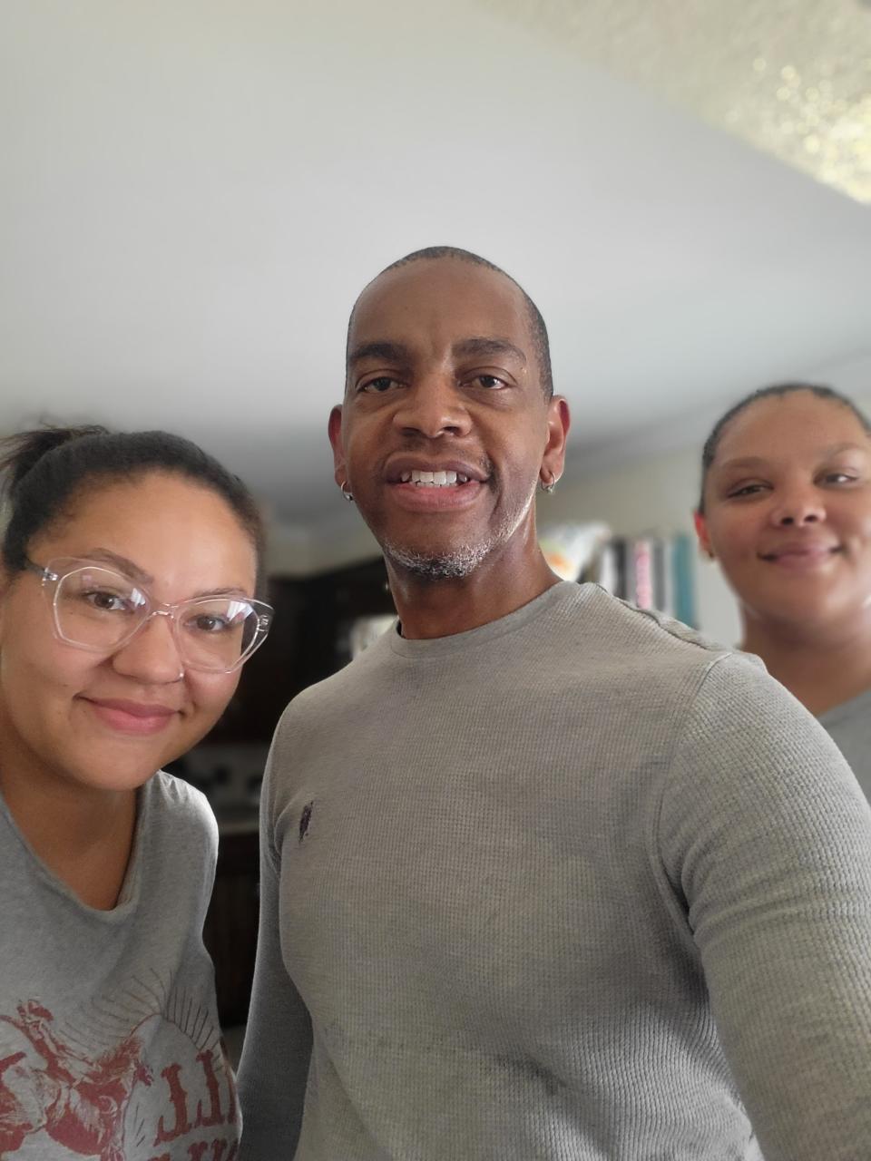 Kevin Ford with his daughters Seryna Ford (left) and Xierra Ford (right).