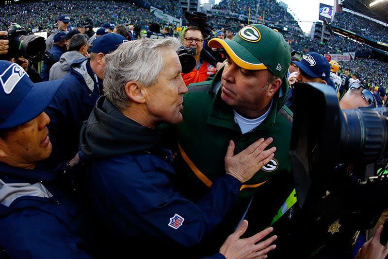 SEATTLE, WA - JANUARY 18: Head coach Pete Carroll of the Seattle Seahawks greets head coach Mike McCarthy of the Green Bay Packers after the Seahawks won the 2015 NFC Championship game at CenturyLink Field on January 18, 2015 in Seattle, Washington.  (Photo by Tom Pennington/Getty Images)