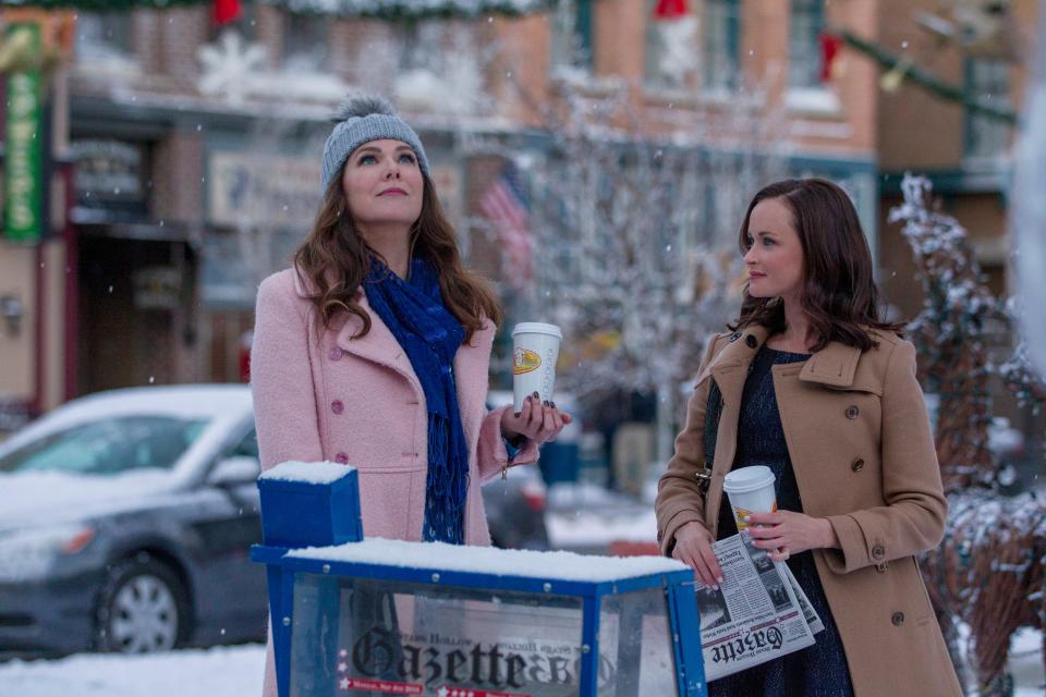 Lorelai Gilmore (Lauren Graham) and daughter Rory (Alexis Bledel) contemplate their quirky Connecticut town in Netflix's 'Gilmore Girls: A Year in the Life.'