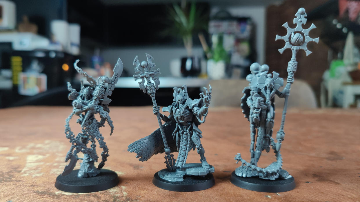  The trio of new Necron models on a battlemat. 