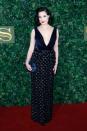 <p>A red-lipped Dita Von Teese looked suitably glamorous in a plunging velvet gown with an embellished skirt and matching navy clutch. Her hair was styled in its signature vintage rolls. <i>[Photo: Getty]</i> </p>