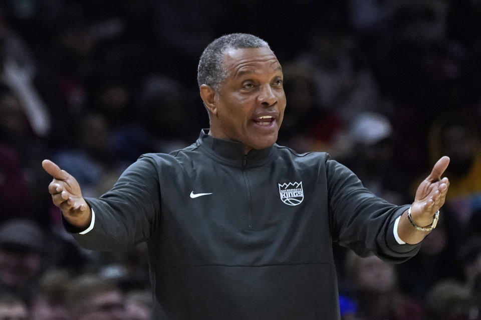 Sacramento Kings coach Alvin Gentry argues a call with an official during the second half of the team's NBA basketball game against the Cleveland Cavaliers, Saturday, Dec. 11, 2021, in Cleveland. The Cavaliers won 117-103. (AP Photo/Tony Dejak)