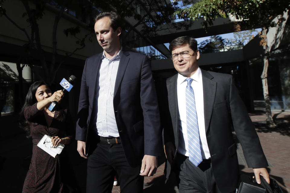 Former Waymo employee Anthony Levandowski, center, walks with his attorney Miles Ehrlichat, right, as they leave a federal courthouse in San Jose, Calif., Tuesday, Aug. 27, 2019. (AP Photo/Jeff Chiu)