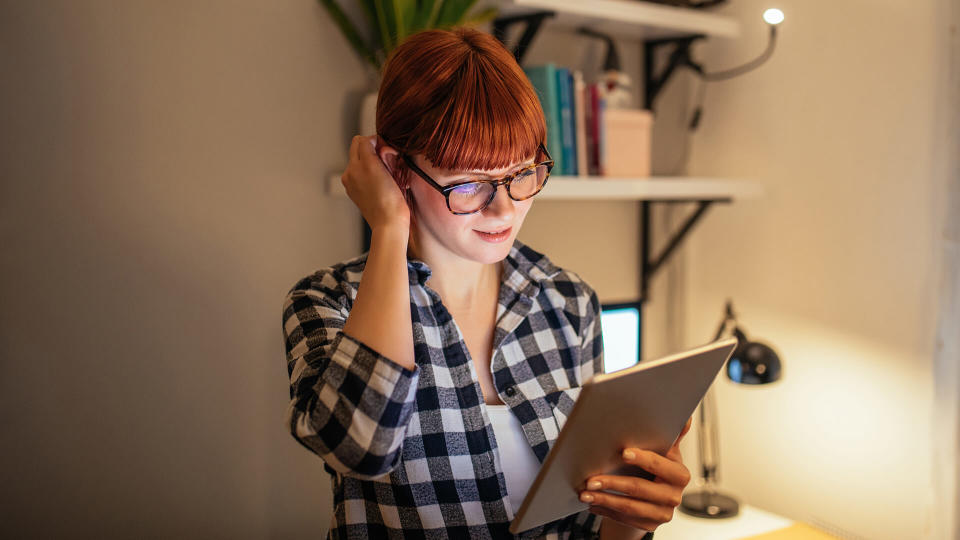 Portrait of a young businesswoman using digital tablet.