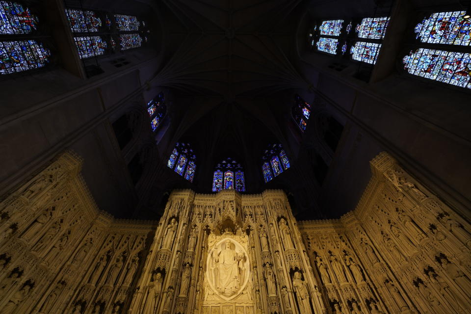 The altar with the Majestus carving of Christ and soaring stained glass windows is seen at the Washington National Cathedral, Thursday, April 1, 2021. (AP Photo/Carolyn Kaster)