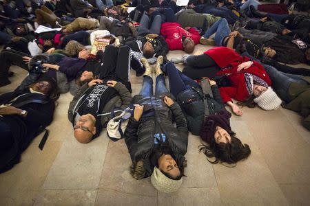 Protesters participate in a "Die-In" at Grand Central Station during a march for chokehold death victim Eric Garner in New York December 6, 2014. REUTERS/Andrew Kelly