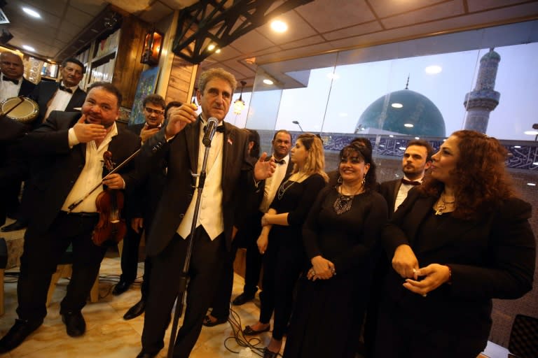 Iraqi musicians perform at a concert at the opening of a cafe-cum-bookshop in Baghdad's Karrada Dakhil