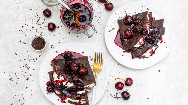 2 plates with black forest chocolate crepe