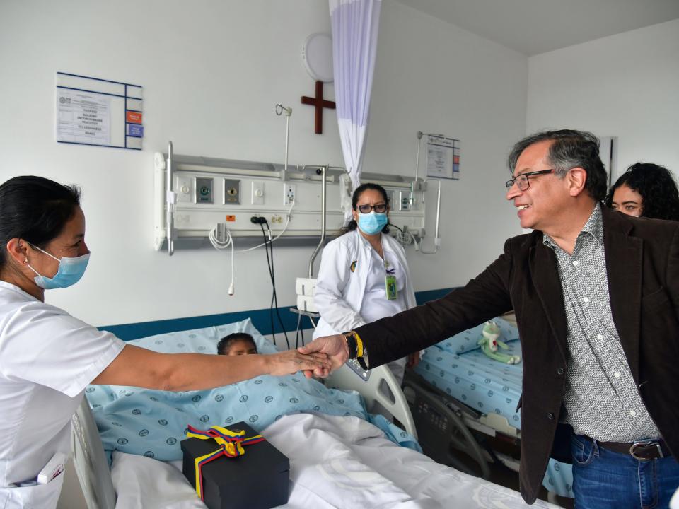 In this handout photo released by the Colombian Presidential Press Office, Colombia's President Gustavo Petro greets a nurse tending to one of the four Indigenous children who survived an Amazon plane crash that killed three adults and then braved the jungle for 40 days before being found alive, at a military hospital in Bogota, Colombia, Saturday, June 10, 2023.