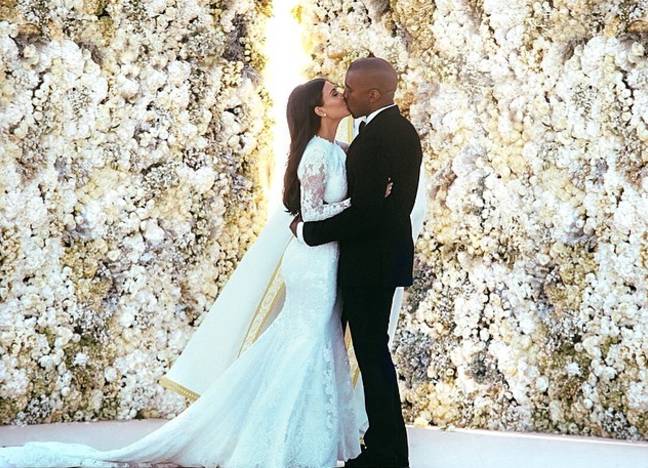 <p>Kim Kardashian and Kanye West <a href="https://www.popsugar.com/celebrity/Kim-Kardashian-Kanye-West-Wedding-Facts-43470534" rel="nofollow noopener" target="_blank" data-ylk="slk:married;elm:context_link;itc:0;sec:content-canvas" class="link ">married</a> in a 16th-century-era fortress in Florence, Italy, in May 2014. They exchanged vows in front of a flower wall as a backdrop, and there were also no E! cameras at the ceremony. </p>