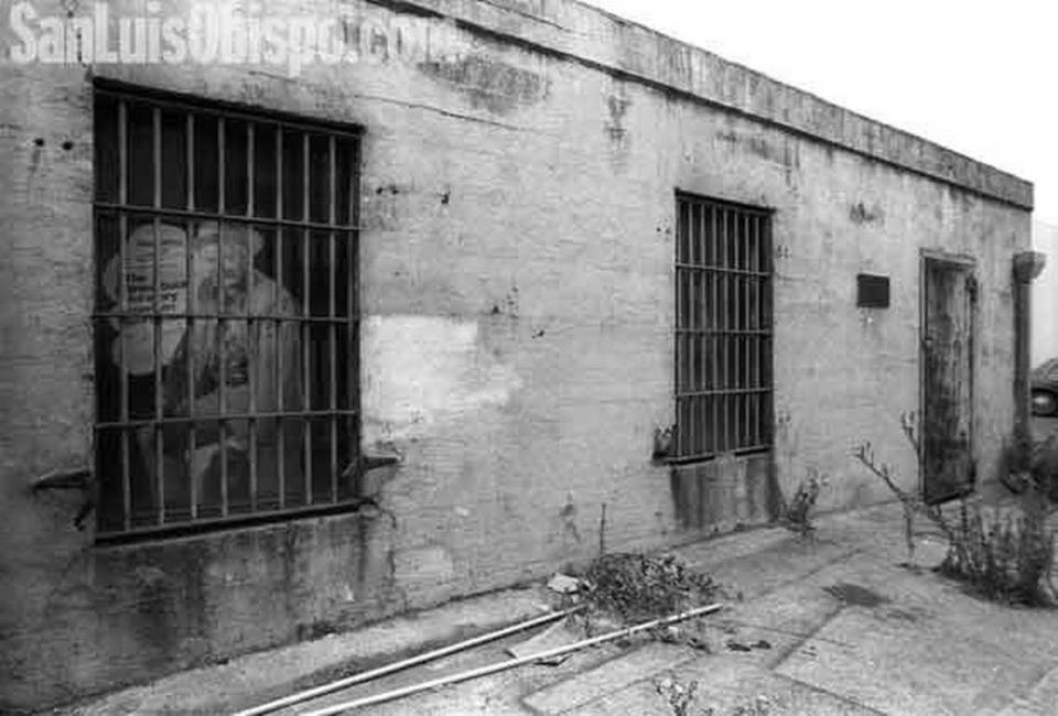 Shoe advertisement hides behind bars of San Luis Obispo’s old jail behind Charles Shoes on Higuera Street.