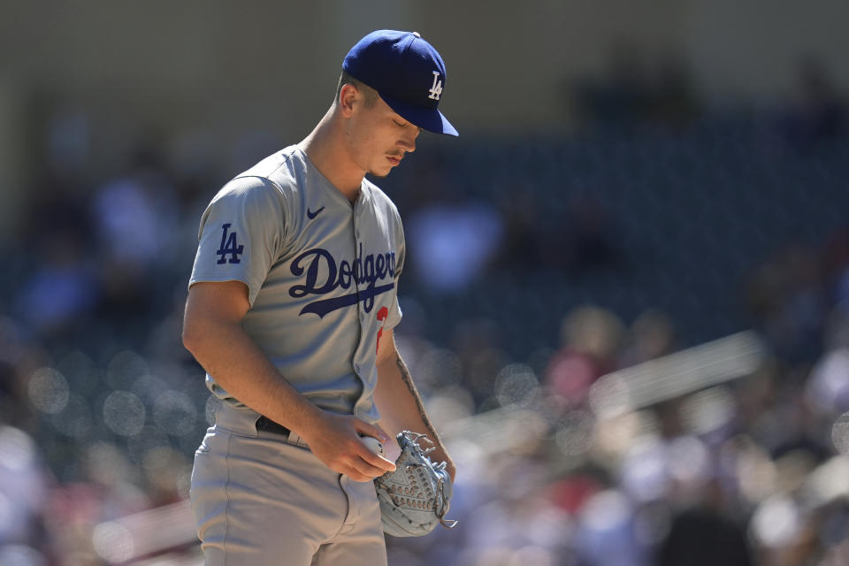 Los Angeles Dodgers starting pitcher Bobby Miller (28) reacts after a solo home run by Minnesota Twins' Edouard Julien during the first inning of a baseball game Wednesday, April 10, 2024, in Minneapolis. (AP Photo/Abbie Parr)