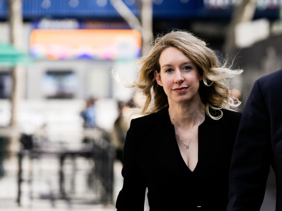 Former Theranos CEO Elizabeth Holmes alongside her boyfriend Billy Evans, walks back to her hotel following a hearing at the Robert E. Peckham U.S. Courthouse on March 17, 2023 in San Jose, California. Holmes appeared in court for a restitution hearing.