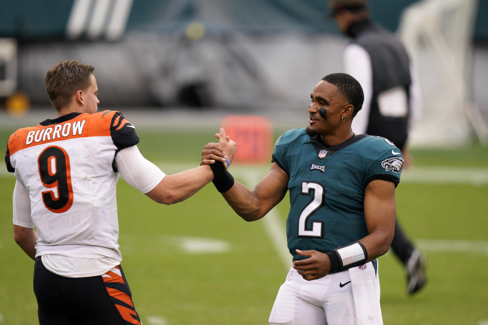 Cincinnati Bengals' Joe Burrow, left, meets with Philadelphia Eagles' Jalen Hurts after an NFL football game, Sunday, Sept. 27, 2020, in Philadelphia. (AP Photo/Chris Szagola)