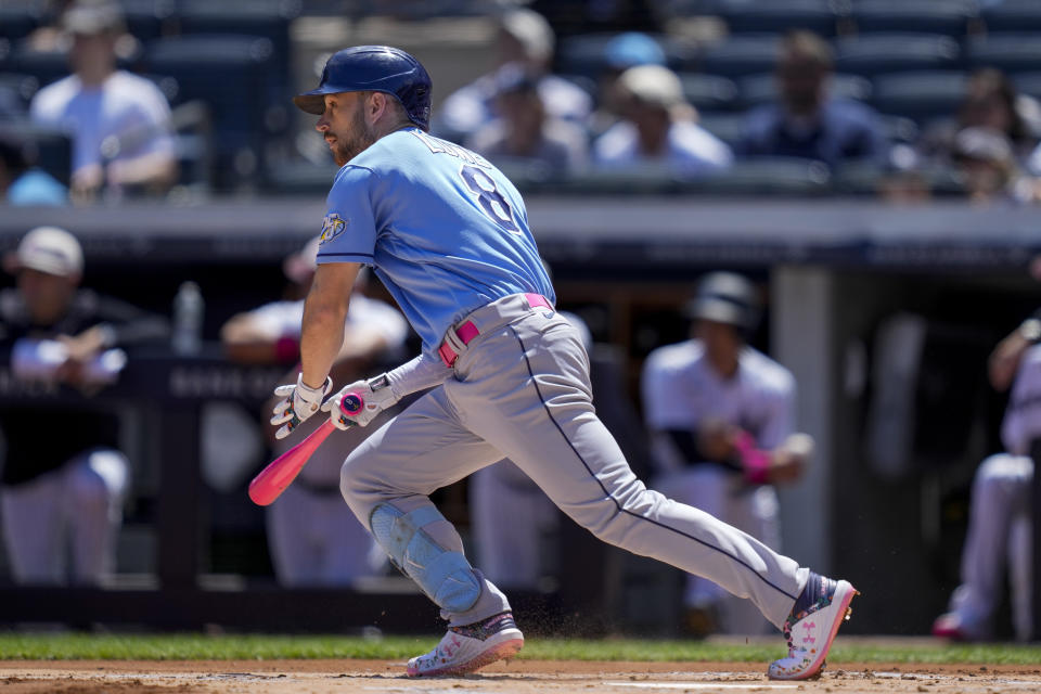 New York Yankees' Brandon Lowe grounds out to allow Yandy Diaz to score on a fielder's choice in the first inning of a baseball game, Sunday, May 14, 2023, in New York. (AP Photo/John Minchillo)