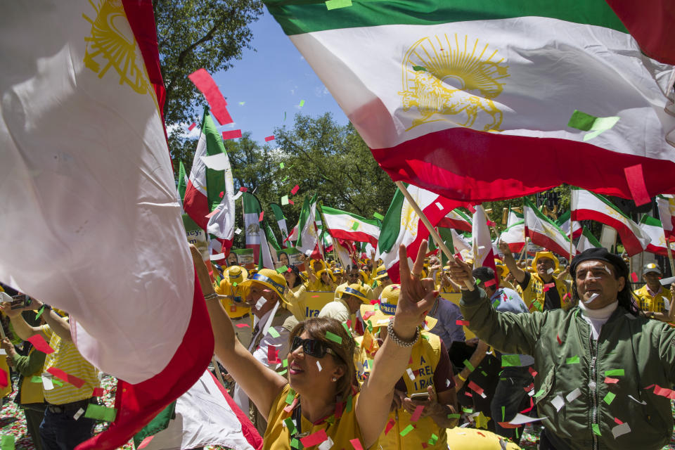 Activists gather at the State Department before a march to the White House to call for regime change in Iran, Friday, June 21, 2019, in Washington. (AP Photo/Alex Brandon)