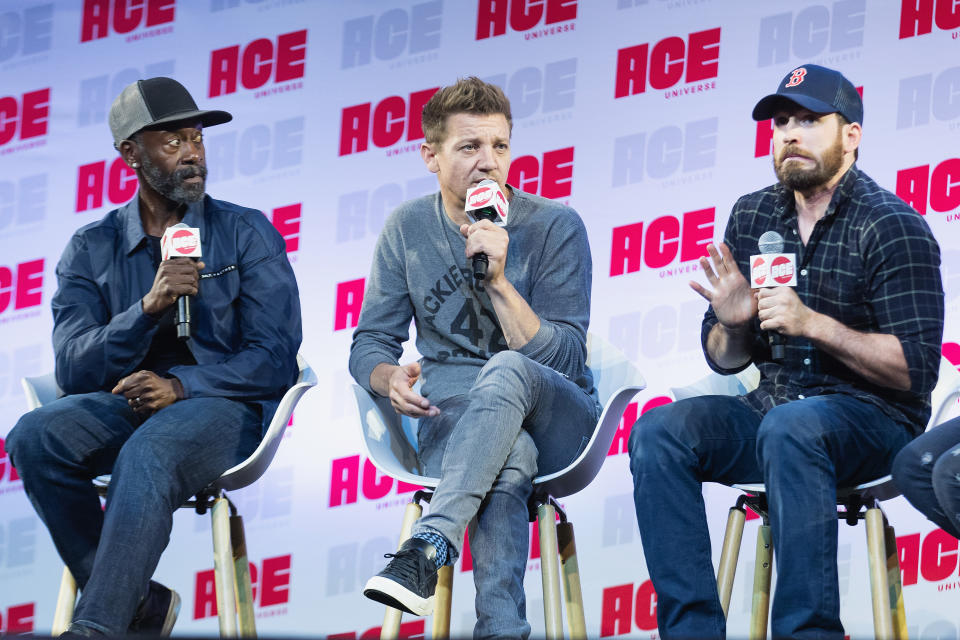 SEATTLE, WA - JUNE 29:  (L-R) Don Cheadle, Jeremy Renner and Chris Evans react after Chris Evans drops and F-Bomb while speaking during ACE Comic Con at Century Link Field Event Center on June 28, 2019 in Seattle, Washington.  (Photo by Mat Hayward/Getty Images)