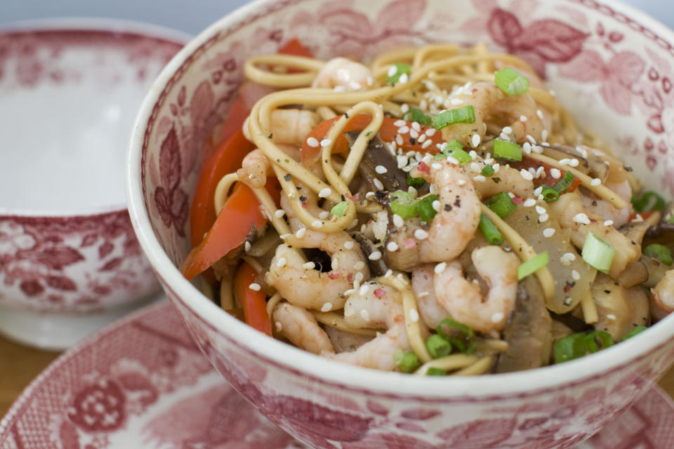 In this image taken on January 14, 2013, shrimp and shitake noodle stir-fry is shown served in a bowl in Concord, N.H. (AP Photo/Matthew Mead)