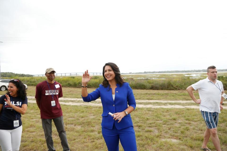 Tulsi Gabbard waves to supporters in North Charleston, South Carolina, on 5 October.