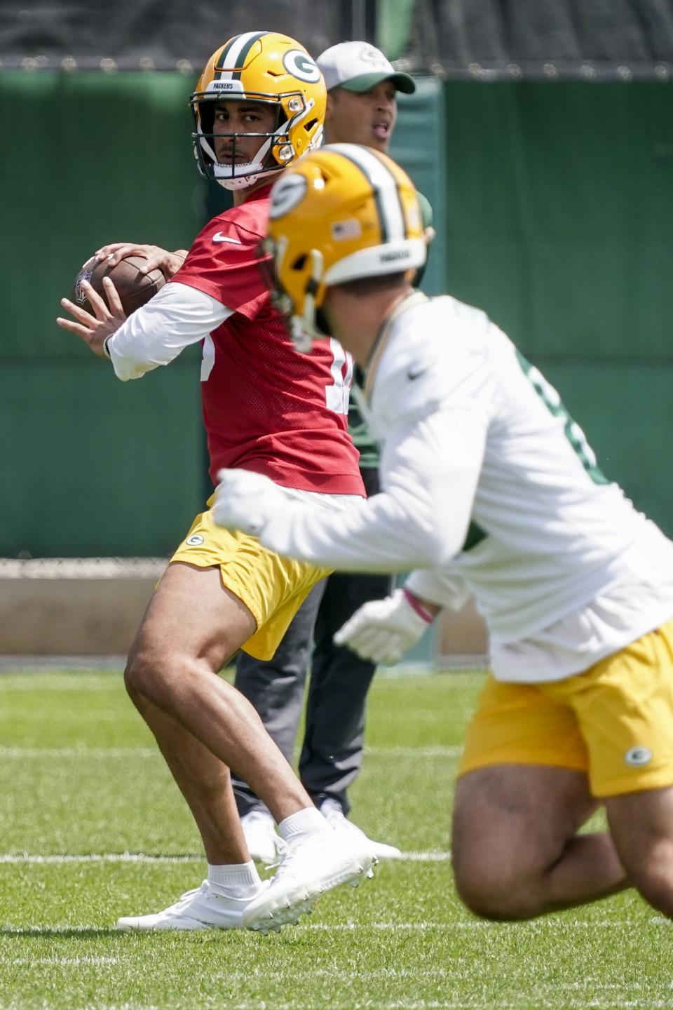 Green Bay Packers' Jordan Love runs a drill at the NFL football team's practice field training camp Tuesday, May 24, 2022, in Green Bay, Wis. (AP Photo/Morry Gash)