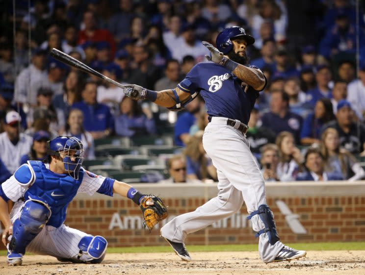 Milwaukee Brewers' Eric Thames hits a double off Chicago Cubs starting pitcher Brett Anderson during the third inning of a baseball game Tuesday, April 18, 2017, in Chicago. (AP Photo/Charles Rex Arbogast)