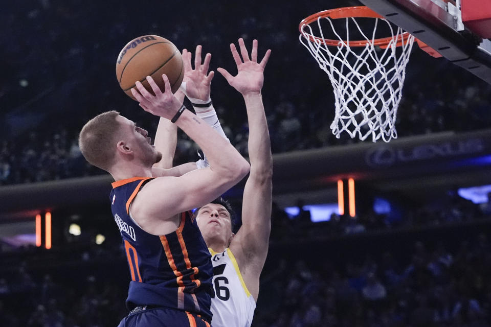 New York Knicks guard Donte DiVincenzo (0) goes to the basket against Utah Jazz forward Simone Fontecchio (16) during the first half of an NBA basketball game, Tuesday, Jan. 30, 2024, at Madison Square Garden in New York. (AP Photo/Mary Altaffer)