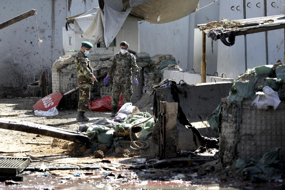 Afghan security forces work at the site of a suicide attack near the U.S. Embassy in Kabul, Afghanistan, Tuesday, Sept. 17, 2019. Hours earlier Afghan officials said a suicide bomber rammed his motorcycle packed with explosives into the entrance to a campaign rally of President Ashraf Ghani in northern Parwan province, killing over 20 people and wounding over 30. Ghani was present at the venue but was unharmed. The Taliban have claimed both attacks. (AP Photo/Ebrahim Noroozi)