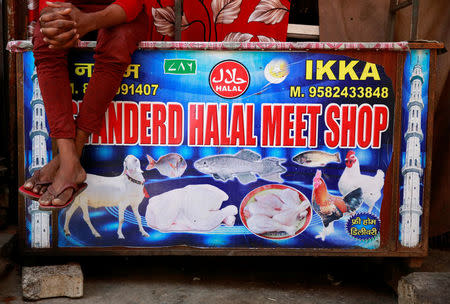 A muslim meat shop owner sits outside his closed shop in Gurugram, Haryana, India March 29, 2017. REUTERS/Cathal McNaughton