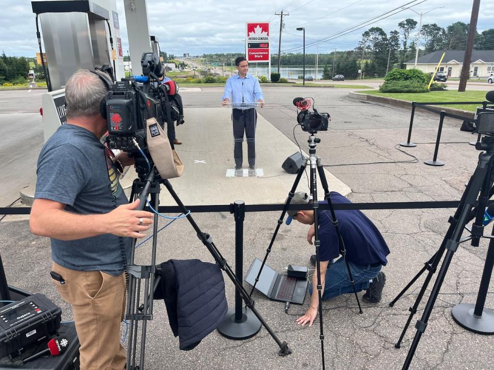 News crews surround Conservative Leader Pierre Poilievre as he holds a news conference at a gas station in Charlottetown during his first official visit to P.E.I. after becoming leader last September.  