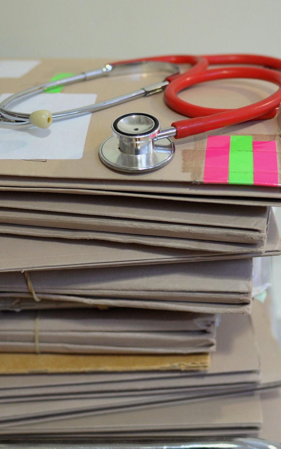 A stack of patient files and a stethoscope - Credit: Anthony Devlin/PA Wire