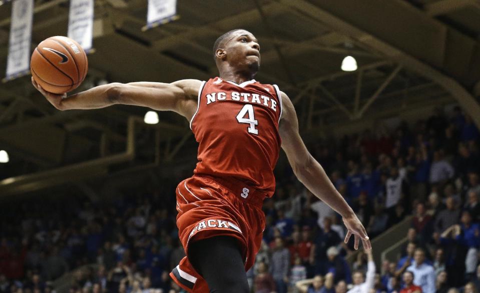 North Carolina State's Dennis Smith Jr. (4) drives to the basket as time expires in the second half of an NCAA college basketball game against Duke in Durham, N.C., Monday, Jan. 23, 2017. N.C. State won 84-82. (AP Photo/Gerry Broome)