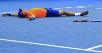 Vasek Pospisil of Canada celebrates after defeating Paolo Lorenzi of Italy during their men's singles second round match at the Australian Open 2015 tennis tournament in Melbourne January 22, 2015. REUTERS/Stringer (AUSTRALIA - Tags: SPORT TENNIS TPX IMAGES OF THE DAY)