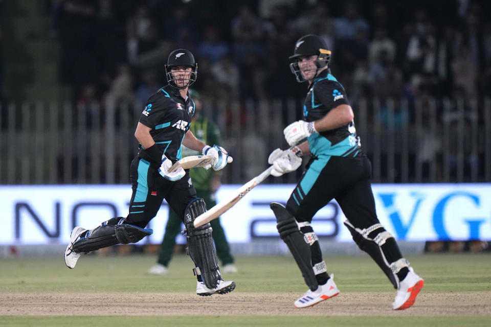 New Zealand's Mark Chapman, left, and Dean Foxcroft run between the wickets during the third T20 international cricket match between Pakistan and New Zealand, in Rawalpindi, Pakistan, Sunday, April 21, 2024. (AP Photo/Anjum Naveed)