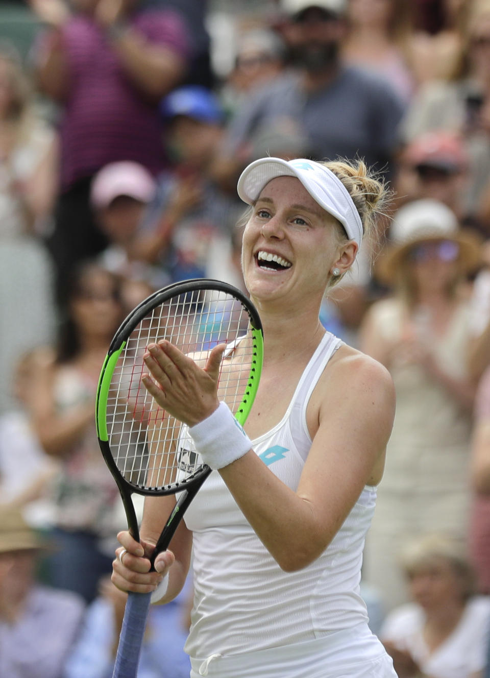 United States' Alison Riske celebrates defeating Australia's Ashleigh Barty in a women's singles match during day seven of the Wimbledon Tennis Championships in London, Monday, July 8, 2019. (AP Photo/Ben Curtis)