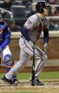 Atlanta Braves' Freddie Freeman follows through on a two-run home run during the eighth inning of a baseball game against the New York Mets, Friday, April 18, 2014, in New York. (AP Photo/Frank Franklin II)