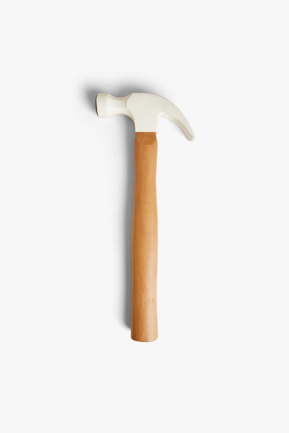 <p>With a forged carbon steel head, cream finish and beech wood handle, the carpenter's hammer is perfect for jobs around the house. It has a smooth face and two claws for removing nails.</p>