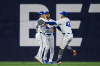 Toronto Blue Jays teammates Daulton Varsho, Kevin Kiermaier and George Springer celebrate after defeating the New York Yankees in a baseball game in Toronto on Monday, April 15, 2024. (Christopher Katsarov/The Canadian Press via AP)