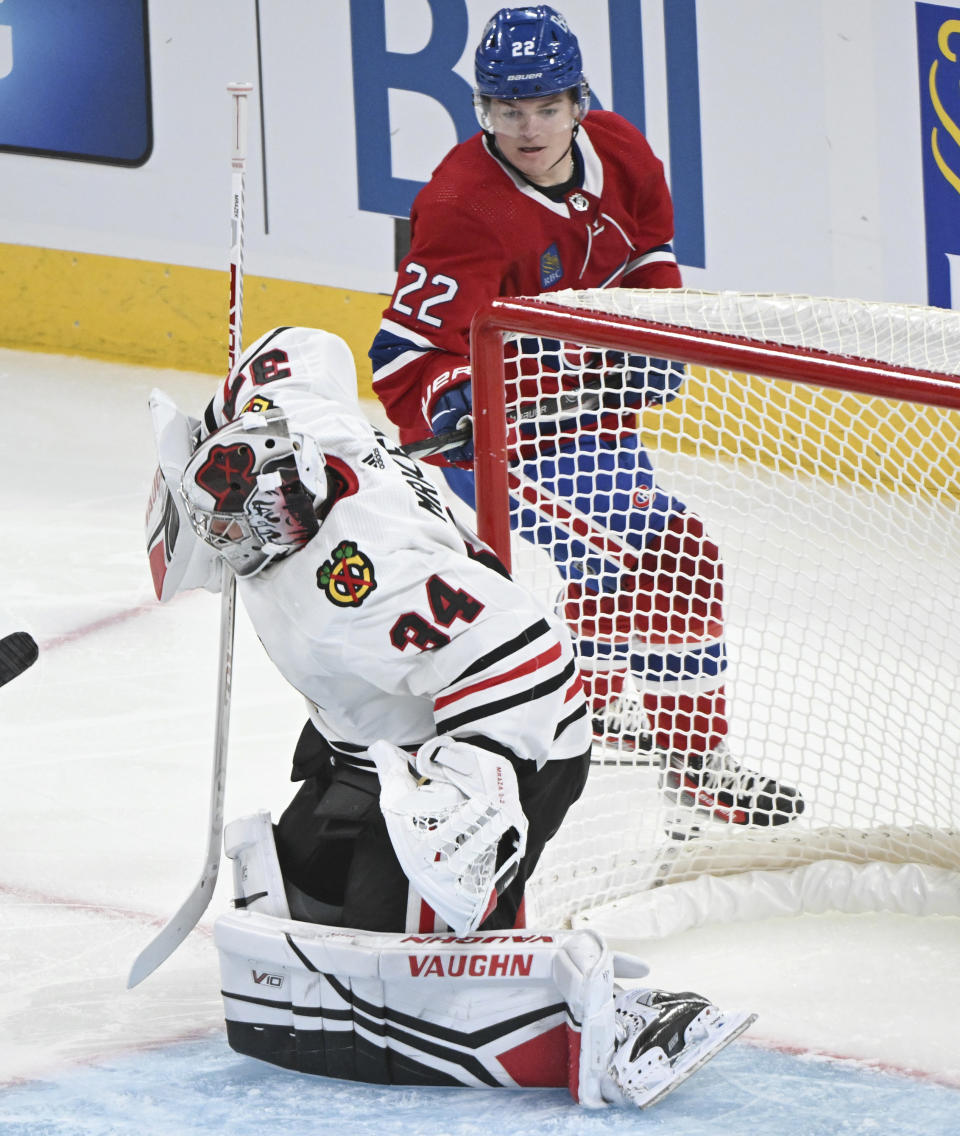 Chicago Blackhawks goaltender Petr Mrazek is scored on by Montreal Canadiens' Cole Caufield during the second period of an NHL hockey game in Montreal, Saturday, Oct. 14, 2023. (Graham Hughes/The Canadian Press via AP)