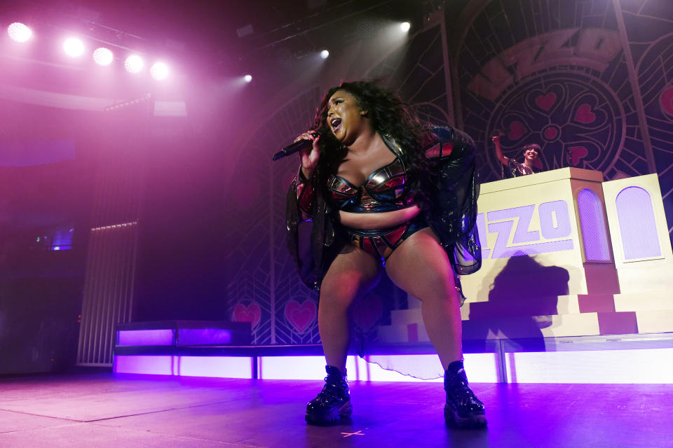 FILE - In this Oct. 19, 2019 file photo, rapper-singer Lizzo performs at The Hollywood Palladium in Los Angeles. Lizzo earned eight Grammy Award nominations, Wednesday, Nov. 20, making her the show’s top-nominated act. The 62nd Grammy Awards will air live from the Staples Center in Los Angeles on January 26. (Photo by Chris Pizzello/Invision/AP, File)