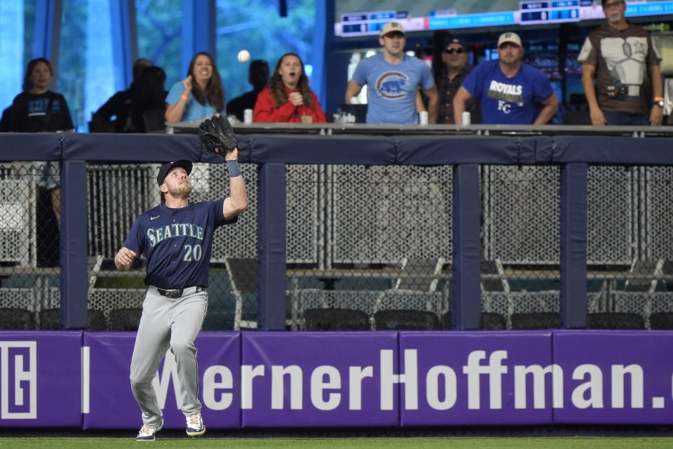 Seattle Mariners left fielder Luke Raley catches a ball hit by Miami Marlins' Josh Bell during the first inning of a baseball game, Sunday, June 23, 2024, in Miami. (AP Photo/Wilfredo Lee)