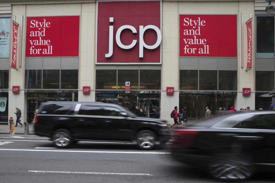 FILE - In this May 16, 2018, file photo, traffic makes its way past a logo J.C. Penney store outside the Manhattan mall in New York. J.C. Penney Co. reports financial results Thursday, Aug. 15..(AP Photo/Mary Altaffer, File)