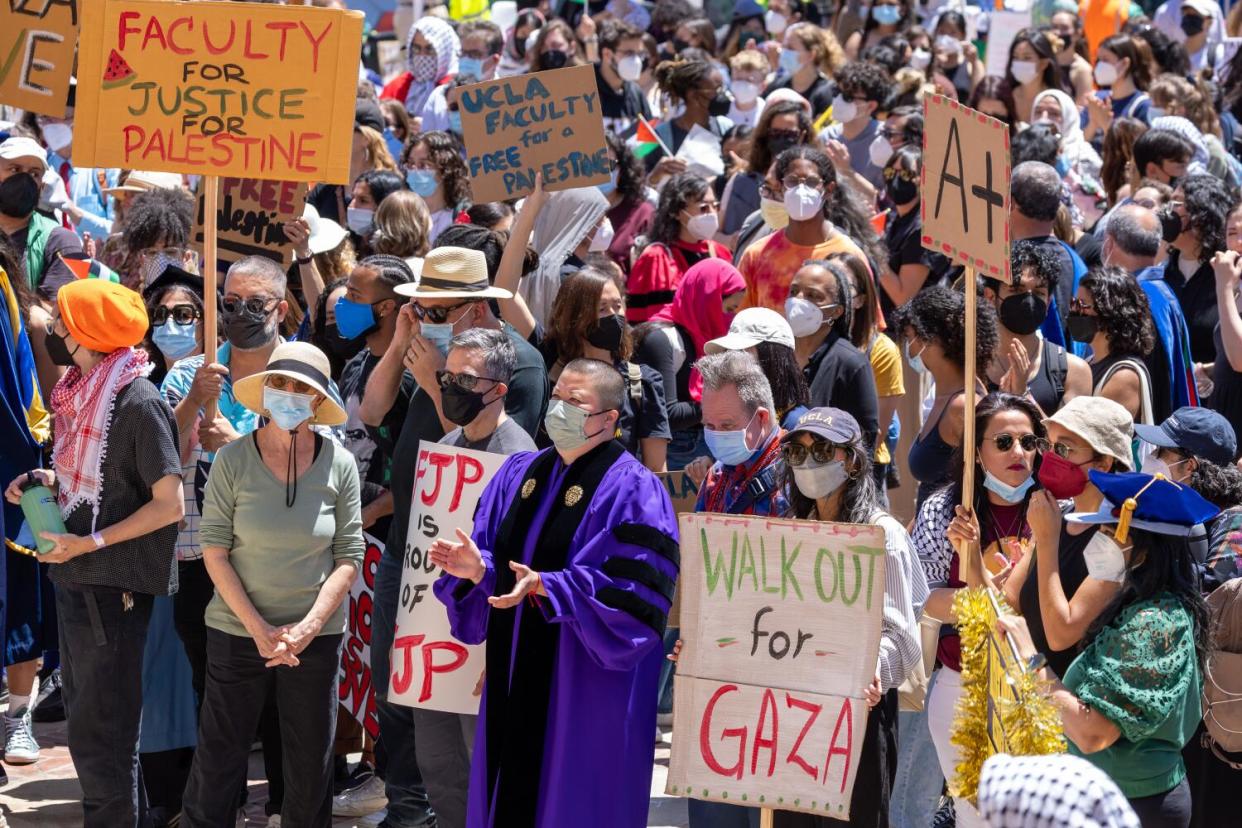 Pro-Palestinian demonstrators hold a student- faculty rally at Dickson Plaza