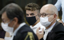 Gabriel Natale-Hjorth, from California, center, sits during a break in the hearing in his trial where he and his friend Finnegan Lee Elder are accused of slaying a plainclothes Carabinieri officer while on vacation in Italy last summer, in Rome, Wednesday, Sept. 16, 2020. (Remo Casilli/Pool Photo via AP)