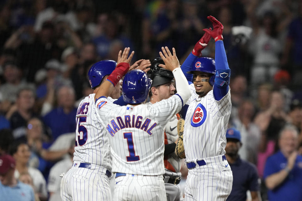Chicago Cubs' Christopher Morel, right, celebrates his three-run home run off San Francisco Giants relief pitcher Luke Jackson with Yan Gomes, left, and Nick Madrigal during the seventh inning of a baseball game Tuesday, Sept. 5, 2023, in Chicago. (AP Photo/Charles Rex Arbogast)